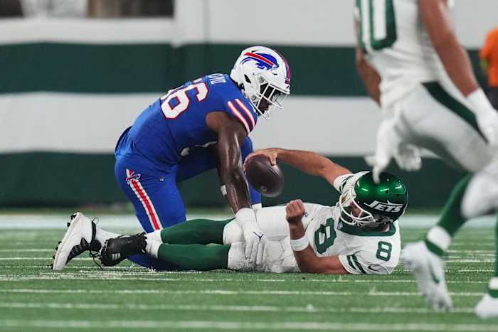 Jets' QB Aaron Rodgers (8) on the ground after being sacked by Leonard Floyd